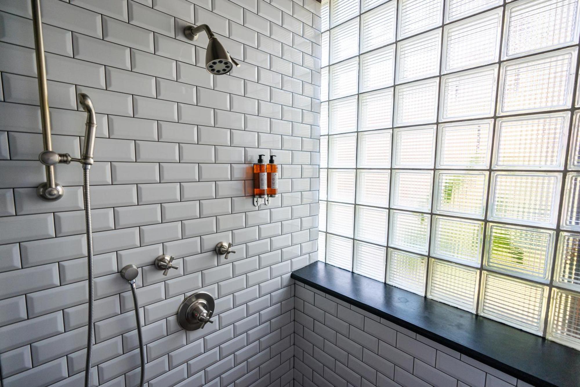 Rooms Hotel Tbilisi Exterior photo A shower with a fixed shower head and a handheld shower head